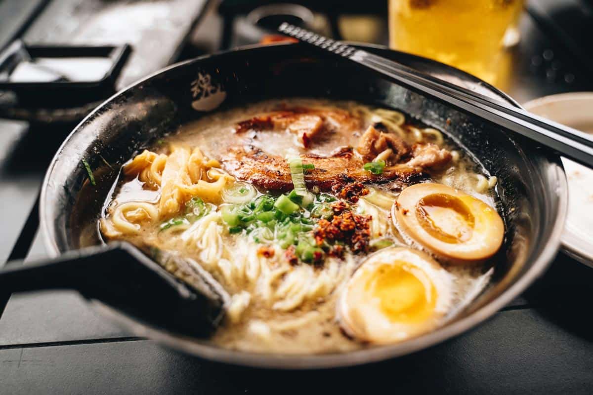 A delicious bowl of ramen with chashu meat and boiled egg.