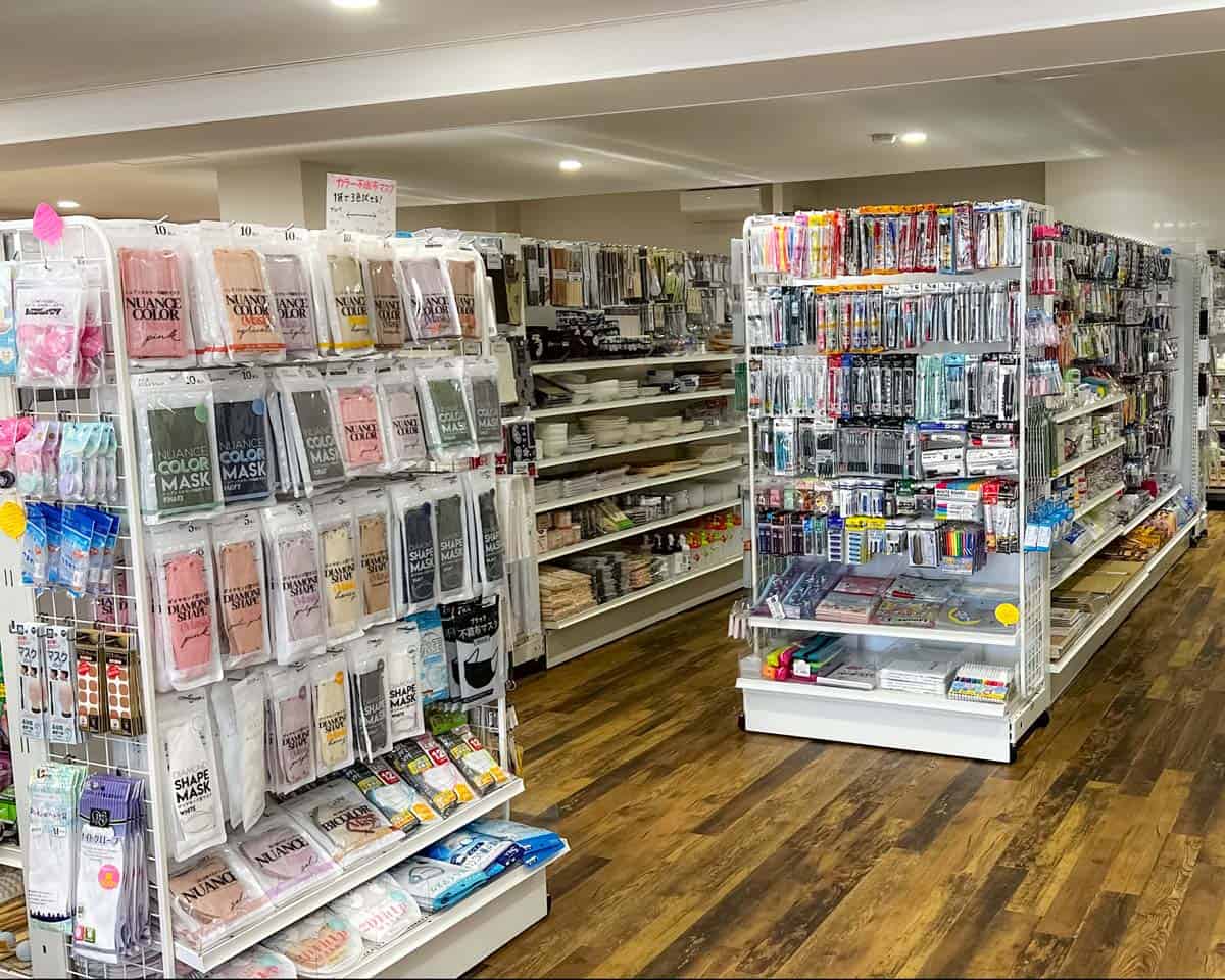 A Japanese 100yen shop showing many items for sale on shelves.