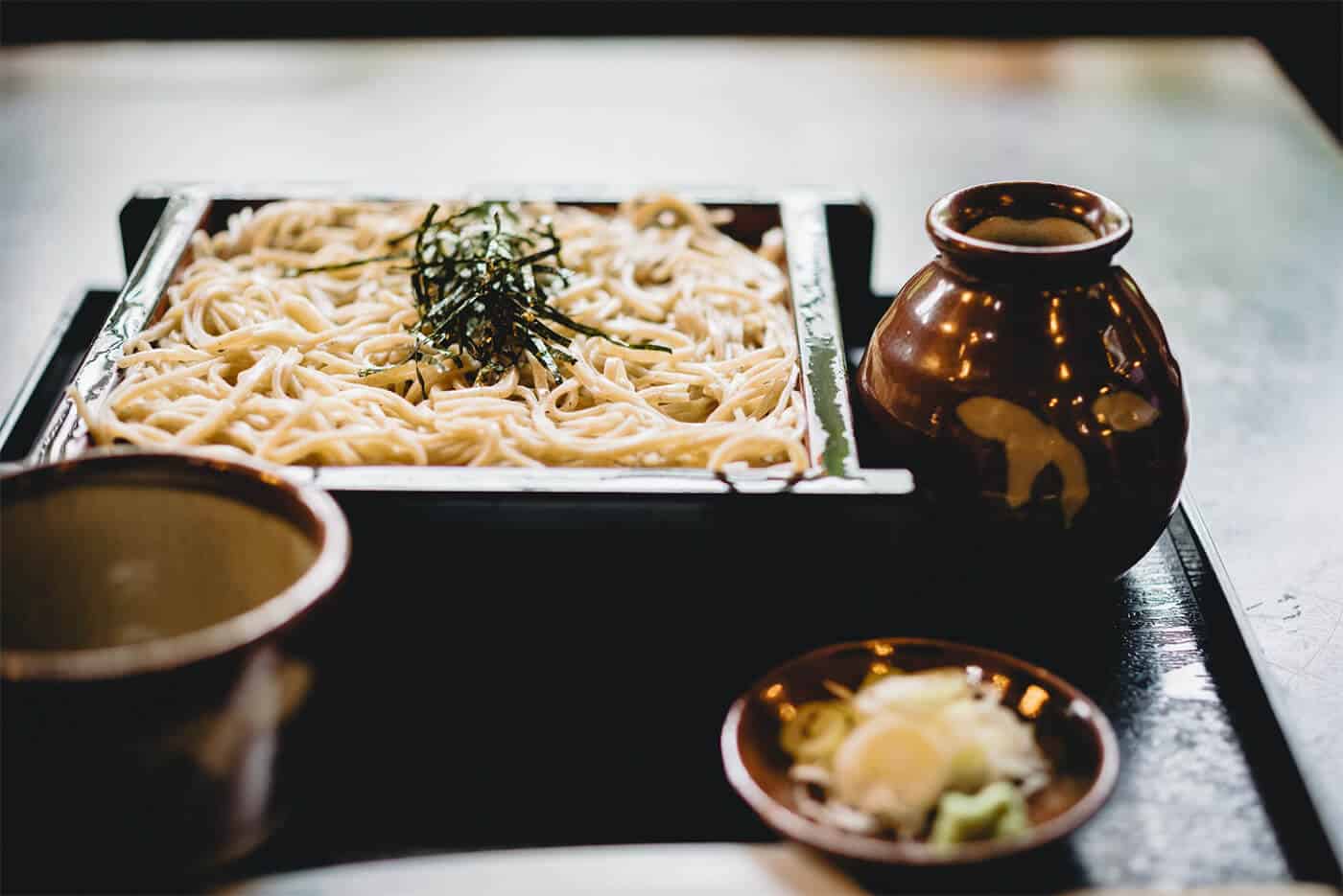 soba noodles in a dish ready to be eaten.
